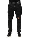 Dolce & Gabbana jean en denim coton noir délavé avec genoux déchirés coupe large et effet vieilli