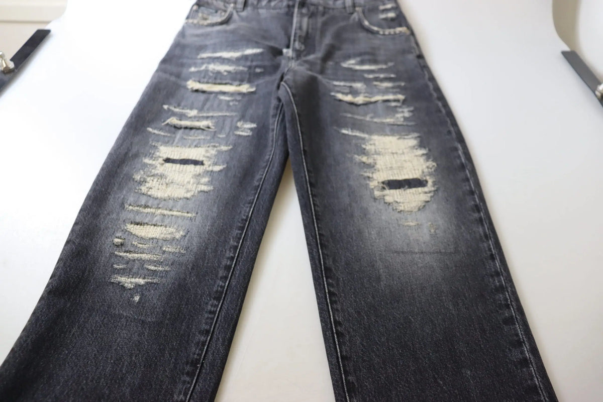 Jean denim noir délavé dolce gabana taille haute avec déchirures et effets usés aux cuisses et genoux