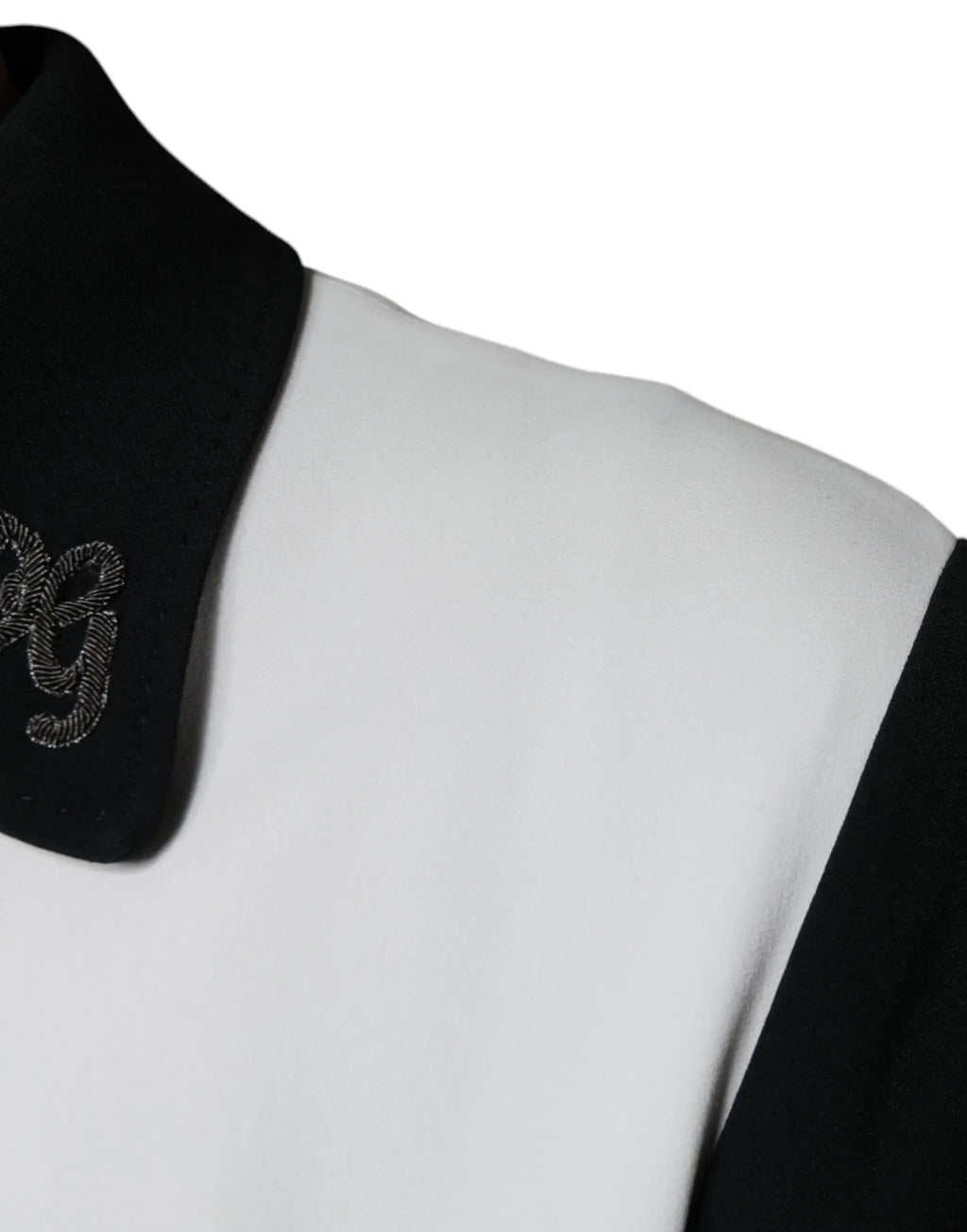Col noir brodé avec fil argent sur le col dune veste blouson full zip dg crown noire et blanche dolce & gabbana