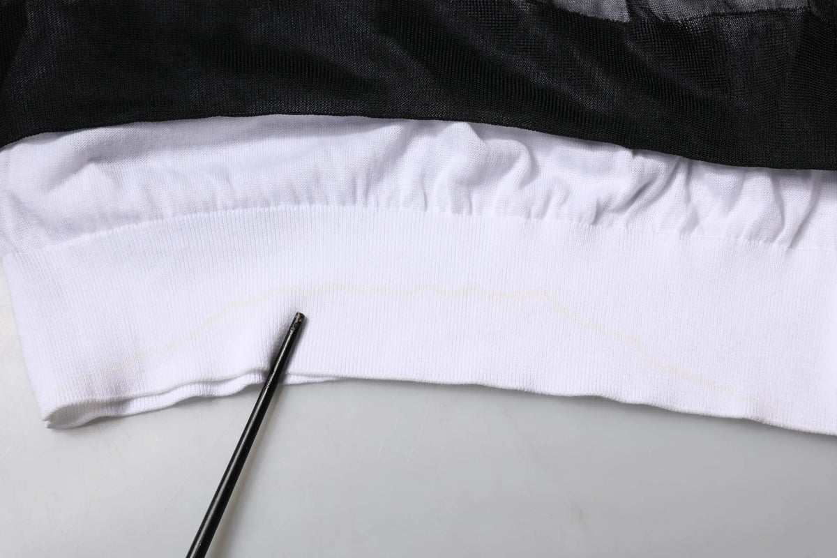 Pull à col roulé dolce & gabbana noir et blanc en maille tricotée avec couche de maille noire superposée