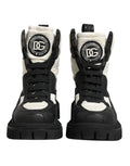 Bottes montantes dolce gabbana noires et blanches avec matelassage et logo audacieux chaussures lacées mi-mollet