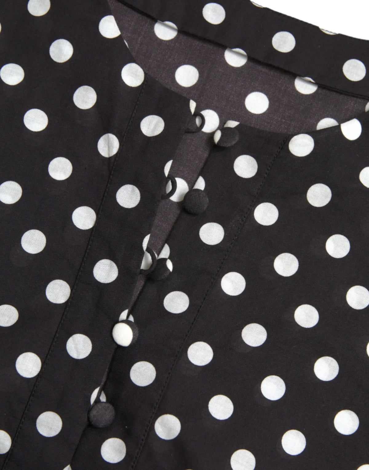 Blouse noire dolce & gabbana en nylon à pois blancs avec boutons noirs pour un look chic et moderne