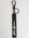 Porte-clés dolce & gabbana pour homme en polyester noir avec logo blanc et attache métal argenté
