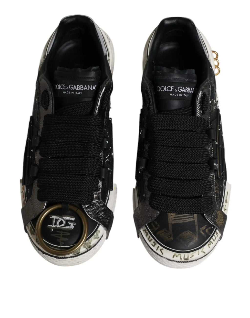 Dolce & gabbana black white portofino low top sneakers with black leather, metallic accents, and graffiti toe cap detailing