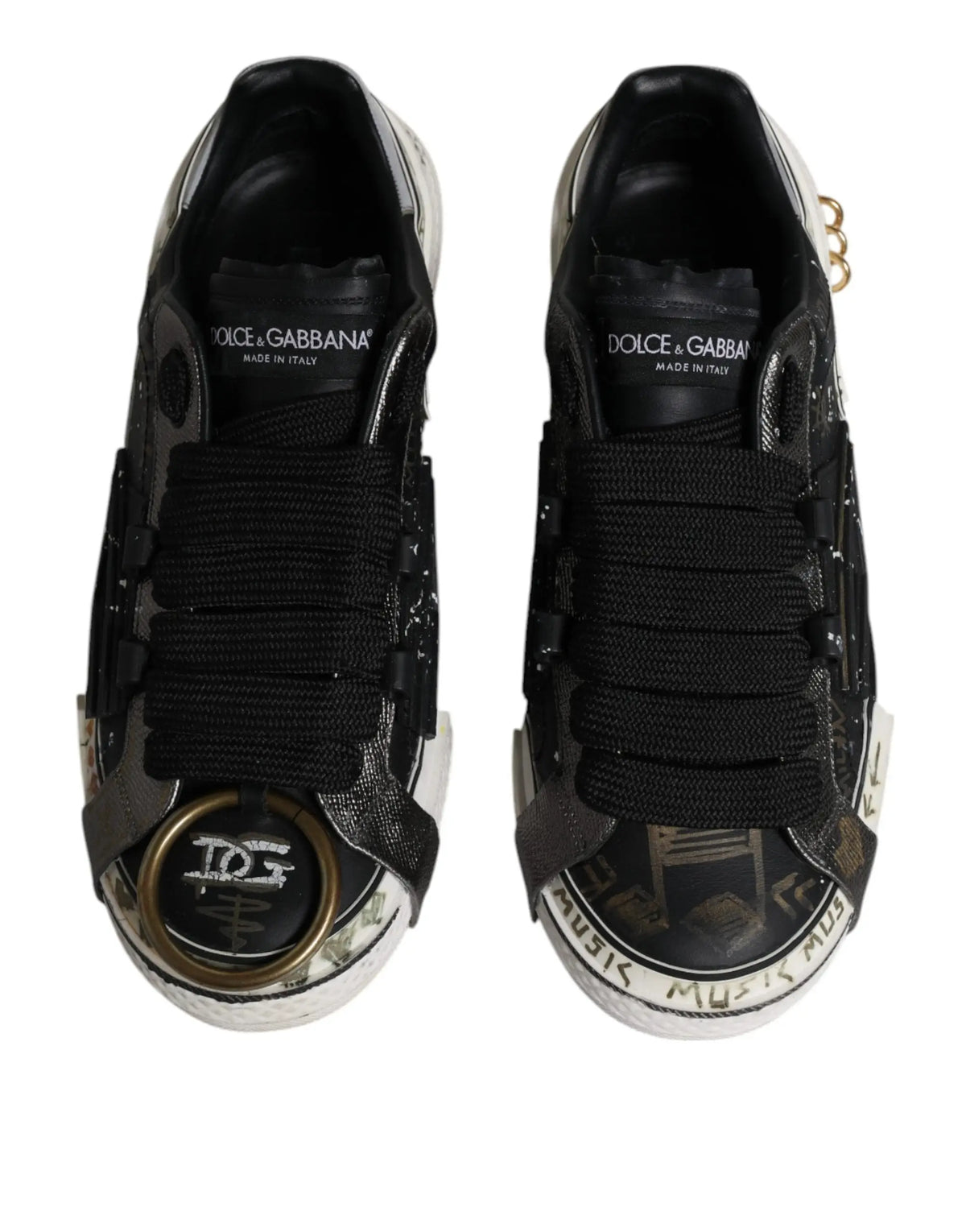 Dolce & gabbana black white portofino low top sneakers with black leather, metallic accents, and graffiti toe cap detailing