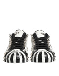 Dolce & Gabbana baskets basses noires et blanches à rayures avec clous argentés pour un style audacieux