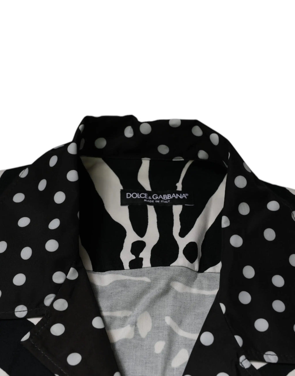 Blouse dolce gabbana noire et blanche à pois avec col zèbre audacieux et label de marque visible