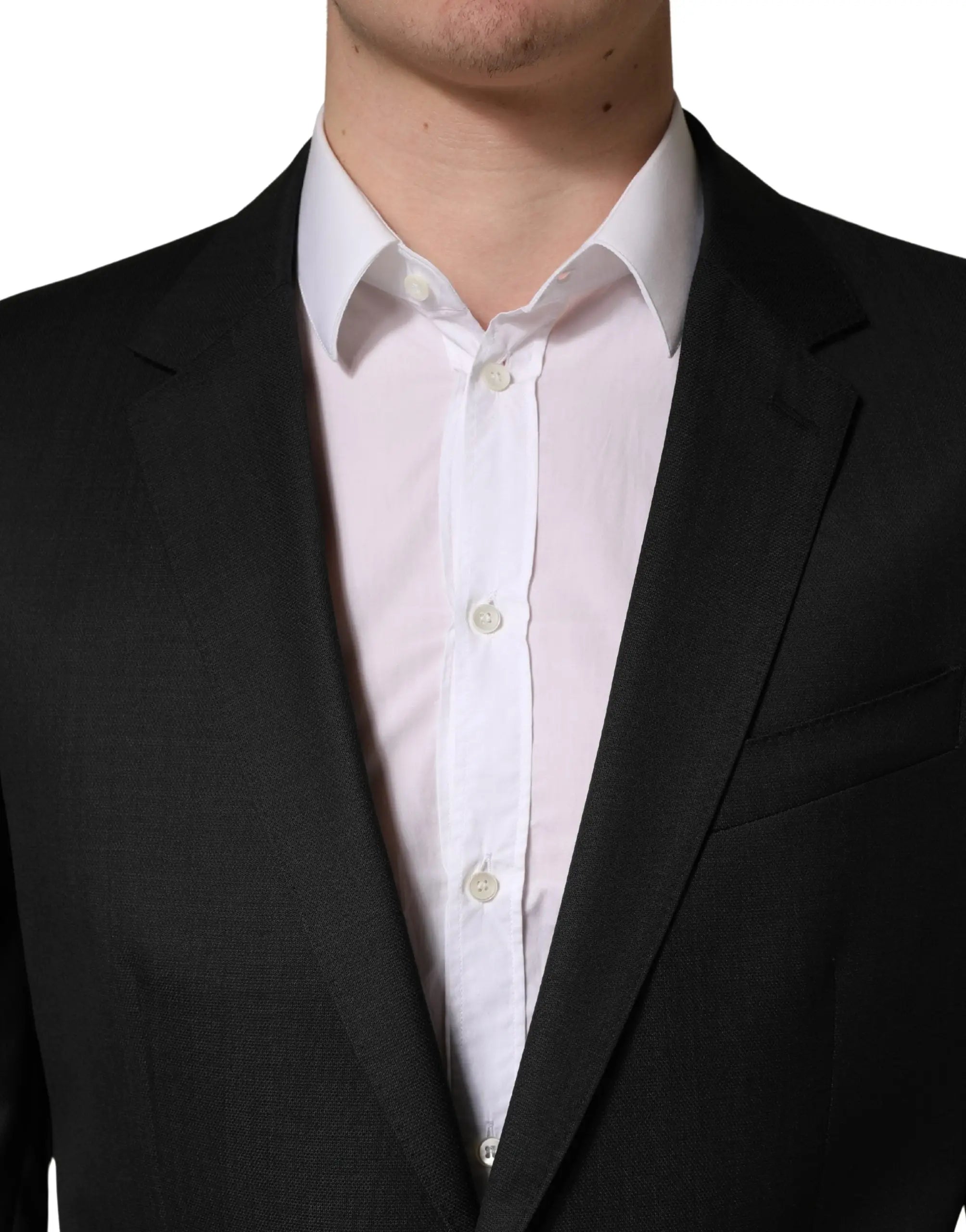 Veste de costume noire dolce & gabbana en laine à deux boutons avec tissage subtil portée sur chemise blanche impeccable