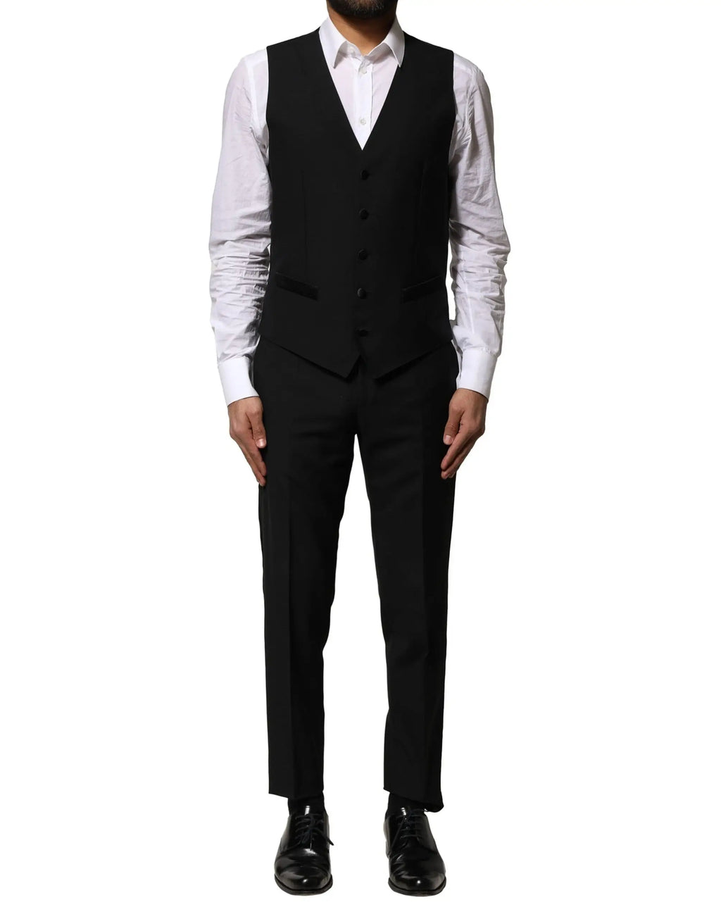 Dolce & gabbana gilet noir en laine ajusté à cinq boutons et revers à cran porté sur chemise blanche