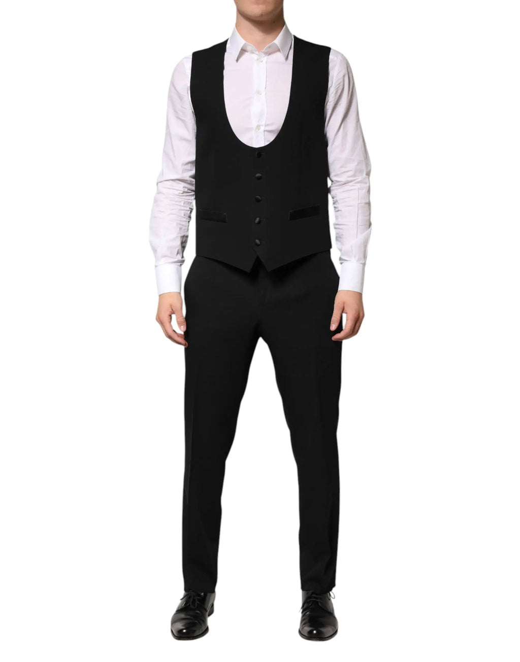 Dolce & gabbana gilet noir en laine tailleur avec cinq boutons foncés et revers crantés porté sur chemise blanche