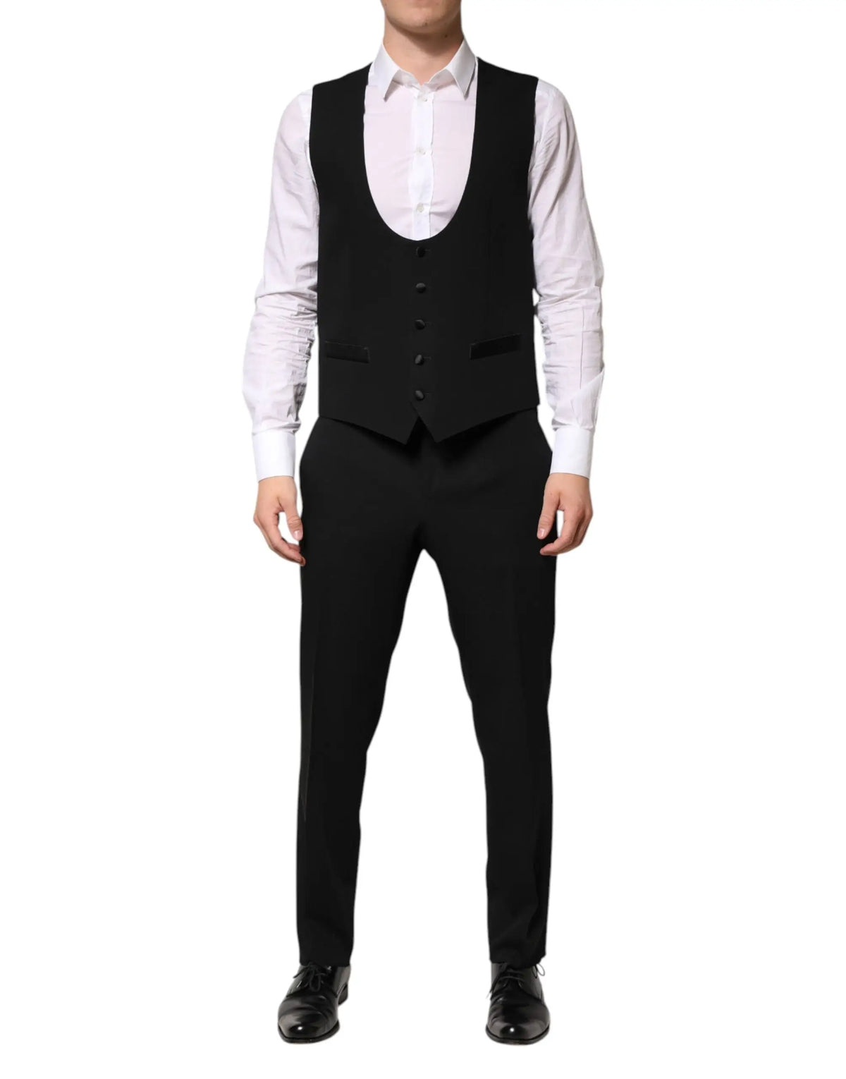 Dolce & gabbana gilet noir en laine tailleur avec cinq boutons foncés et revers crantés porté sur chemise blanche