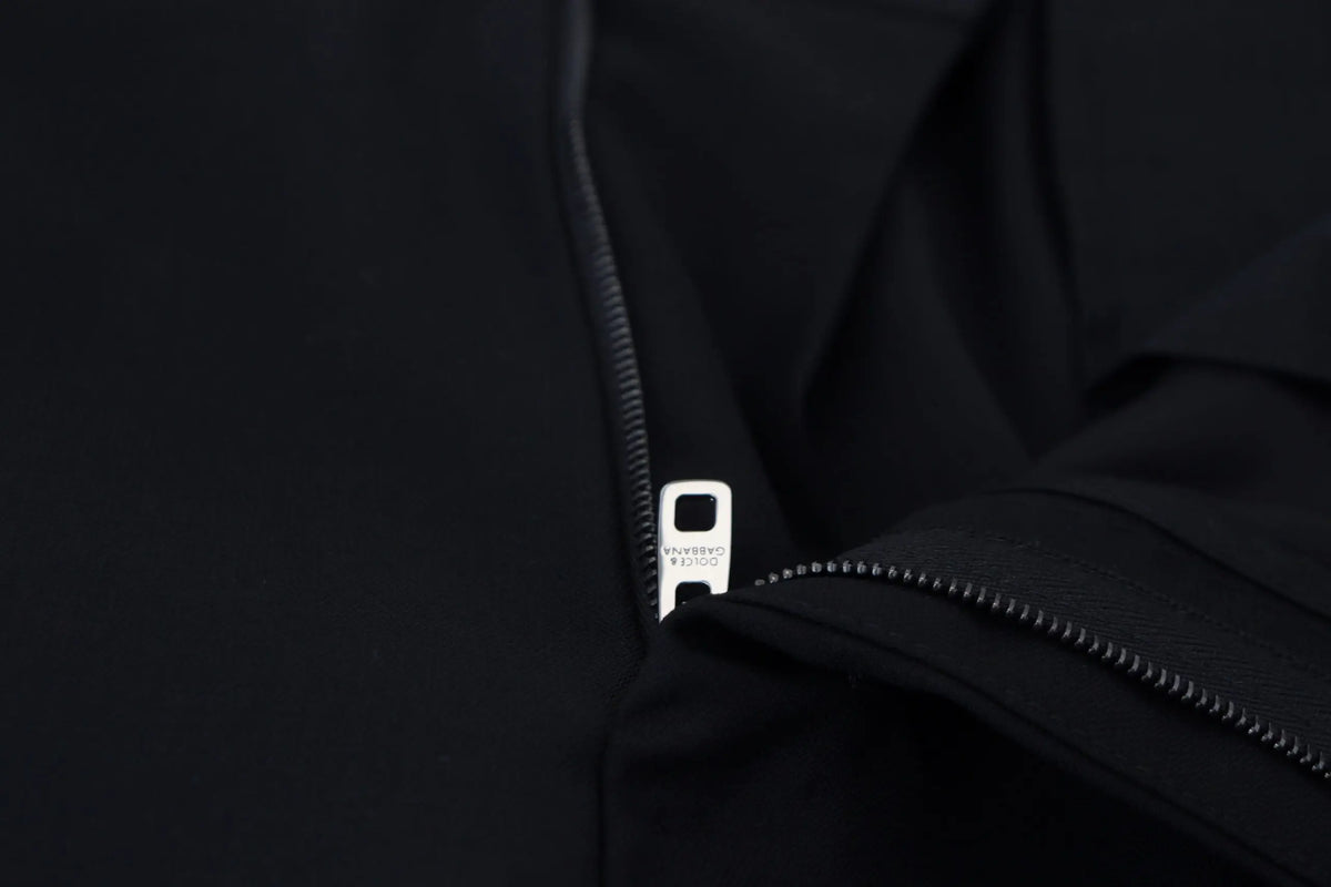 Fermeture éclair en nylon noir avec finition métallique argentée et logo gravé sur un pantalon formel en laine dolce & gabbana