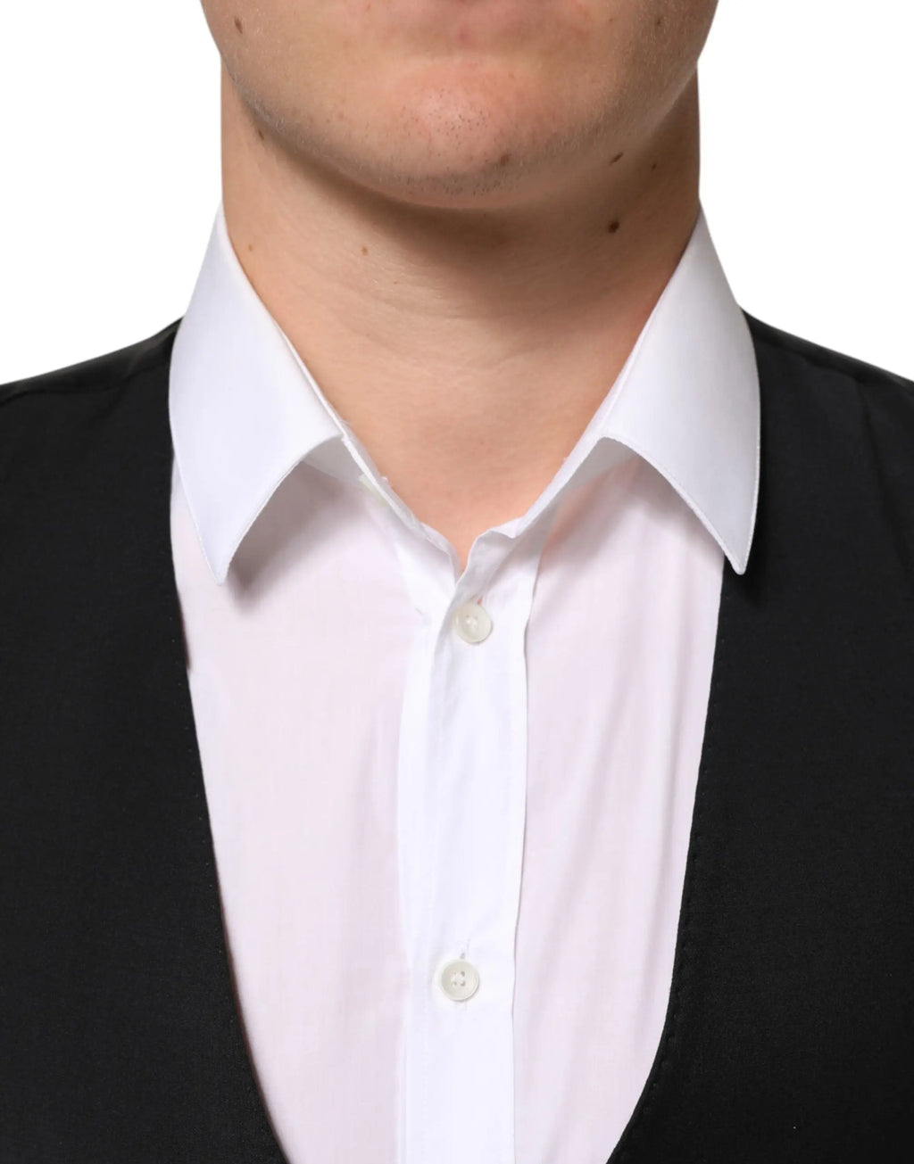 Dolce & gabbana black wool formal men waistcoat vest shown with a white button-down shirt with crisp collar and vertical pleats