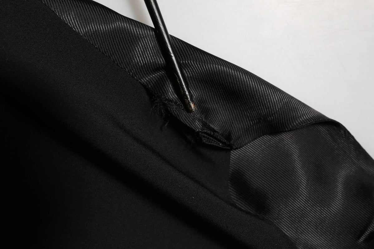 Dolce & gabbana gilet homme noir en laine satinée avec texture côtelée et usure au niveau de la couture