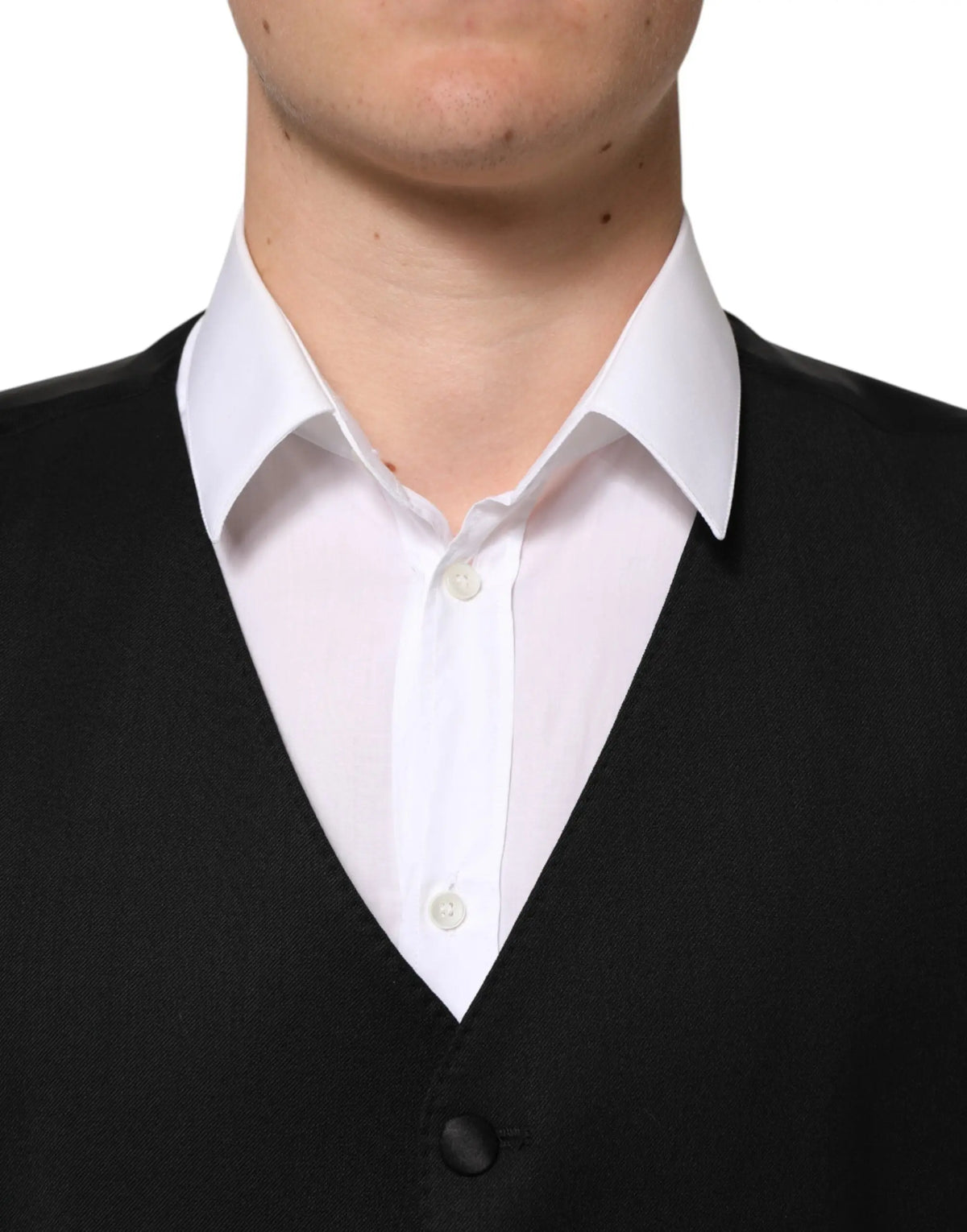 Dolce & gabbana black wool v neck knit vest worn over white button down shirt for formal men
