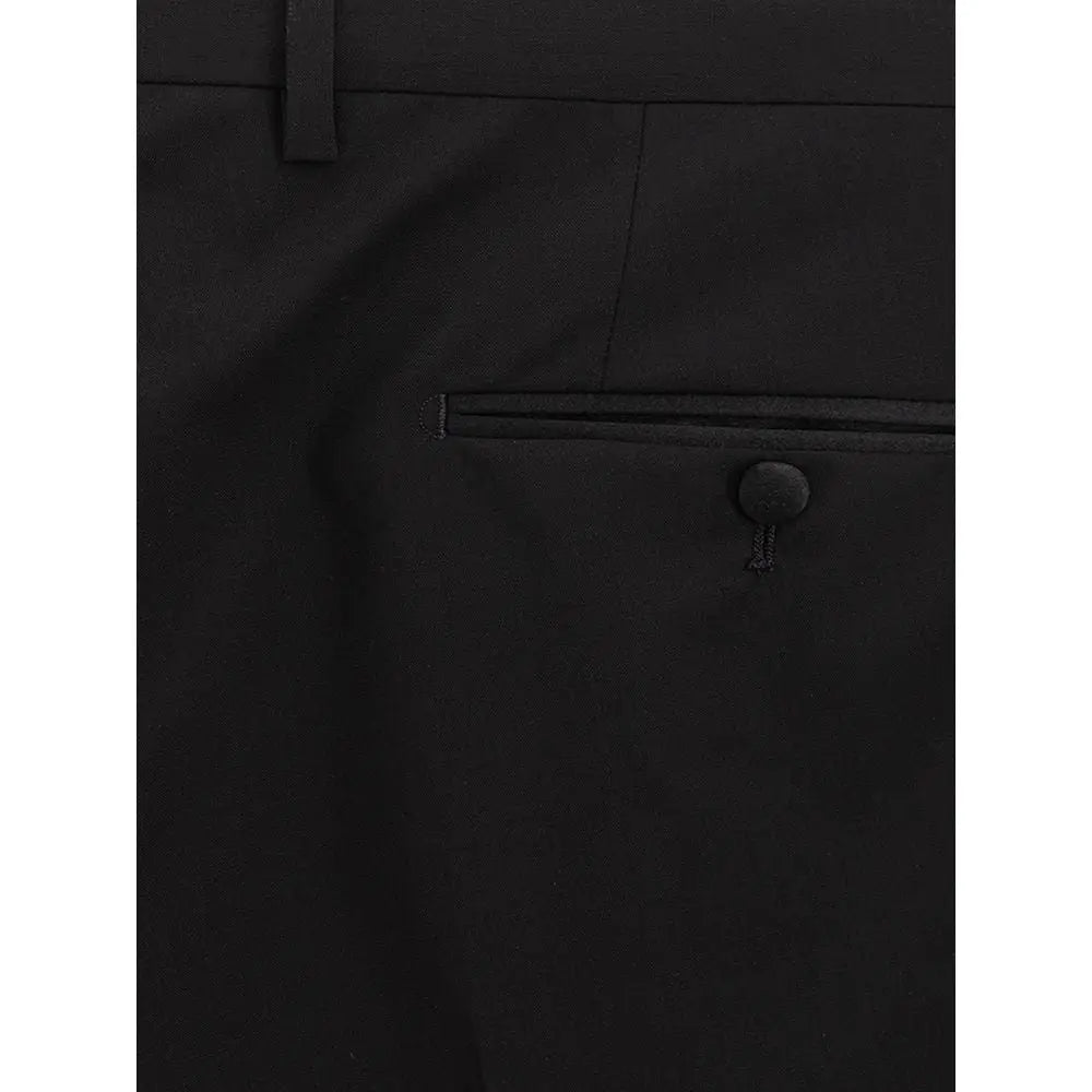 Pantalon habillé en laine noir dolce & gabbana avec une coupe ajustée et des détails de couture subtils