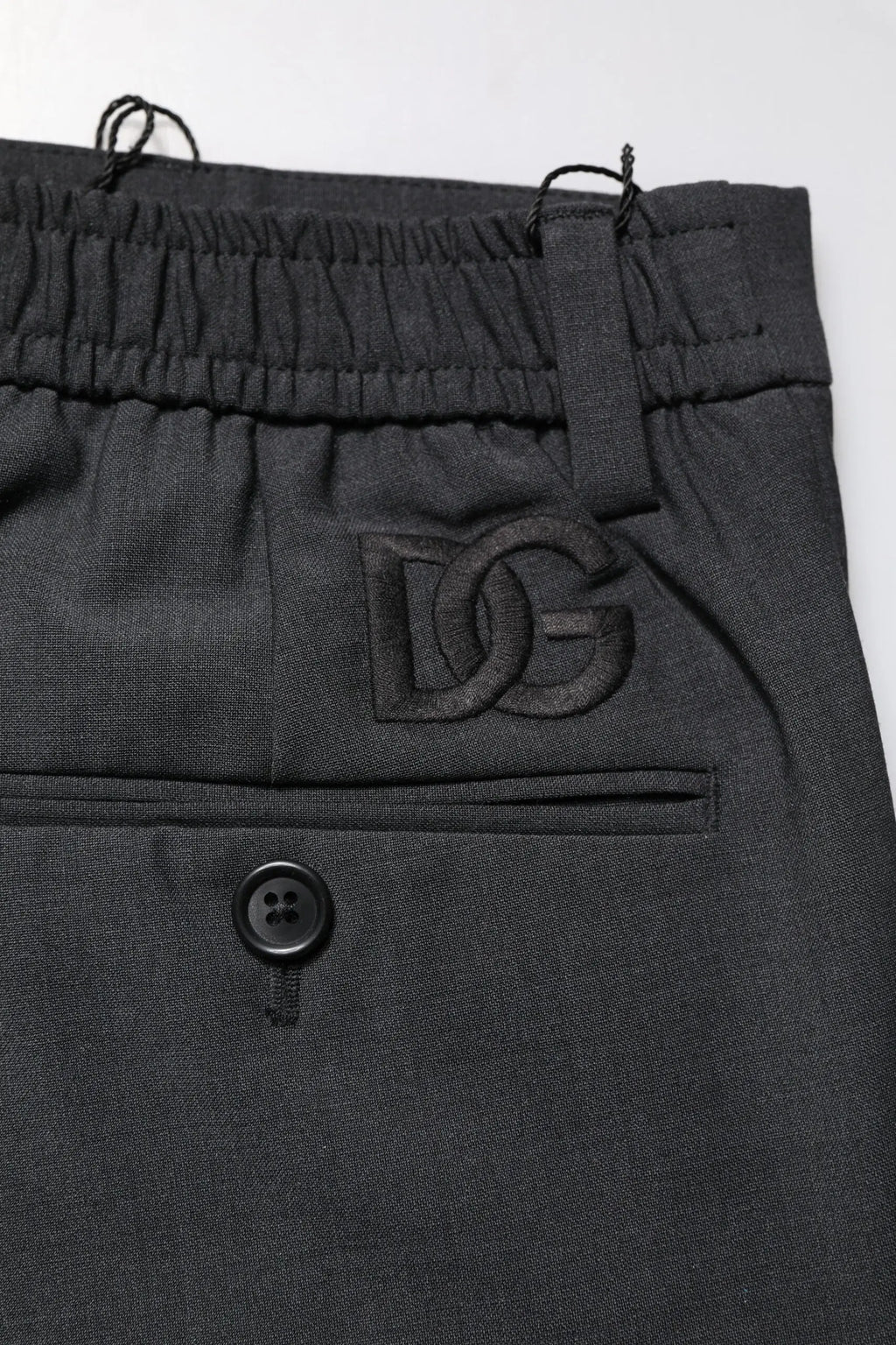 Pantalon slim en laine noire dolce gabbana avec broderie logo dg sur la poche avant pour tenue formelle