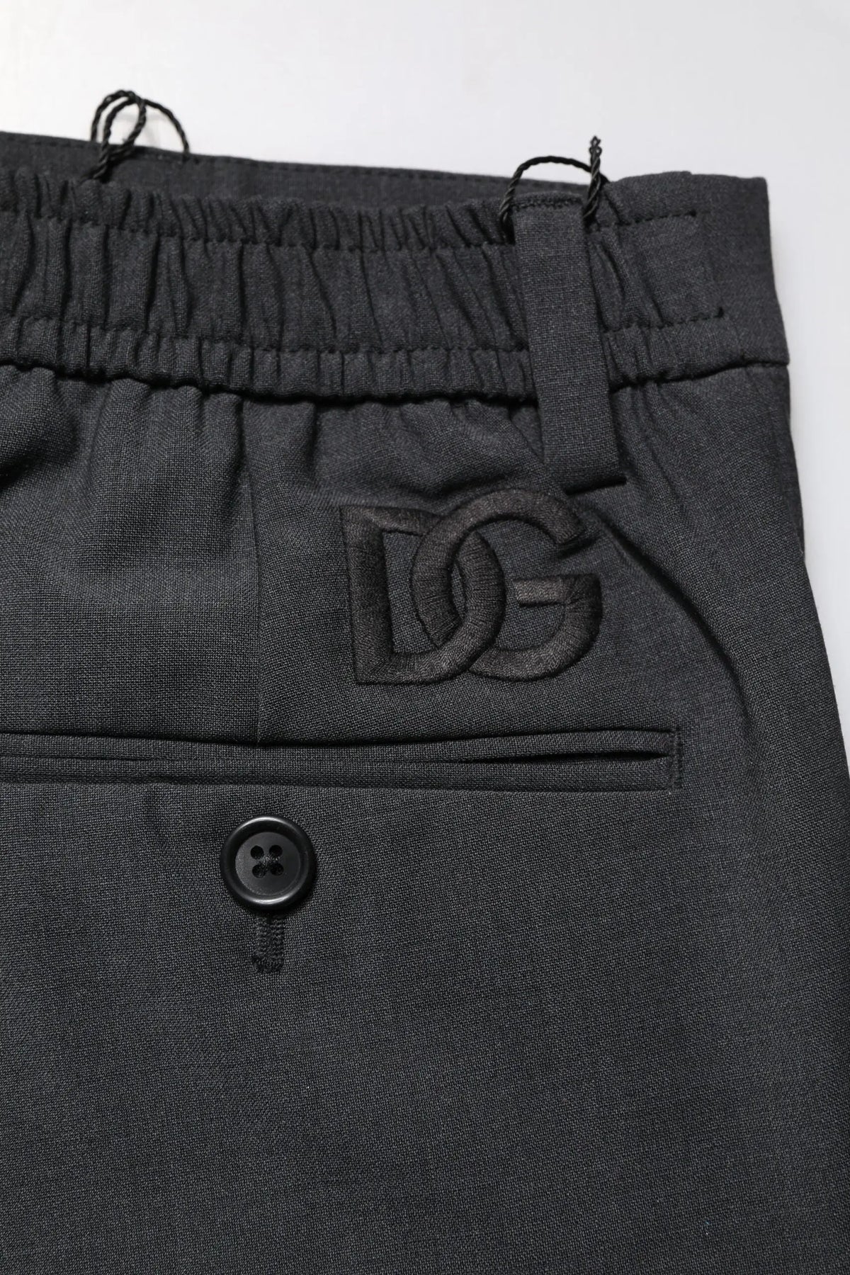 Pantalon slim en laine noire dolce gabbana avec broderie logo dg sur la poche avant pour tenue formelle