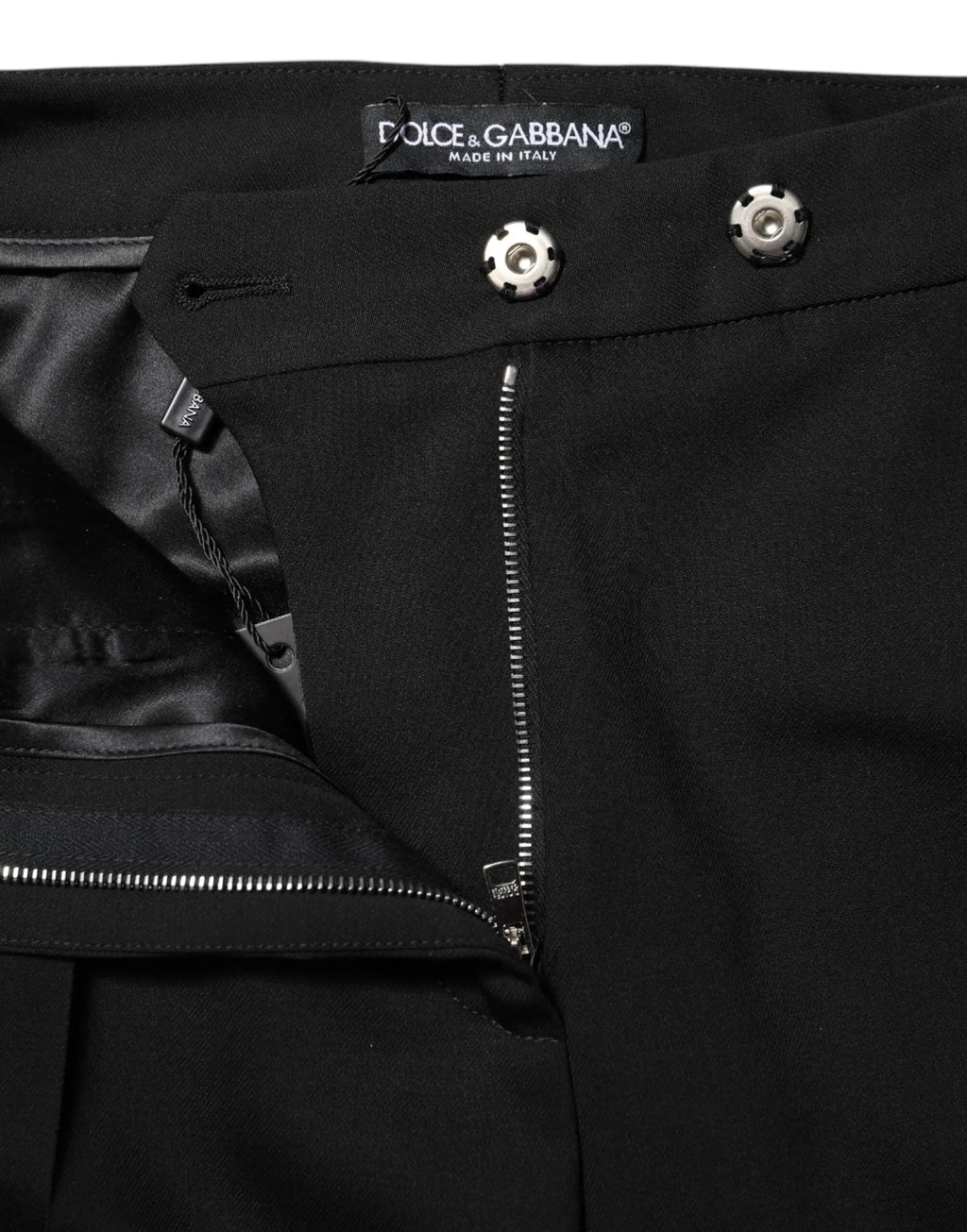 Pantalon évasé taille haute en laine noire dolce & gabbana avec boutons argentés et intérieur doublé en satin