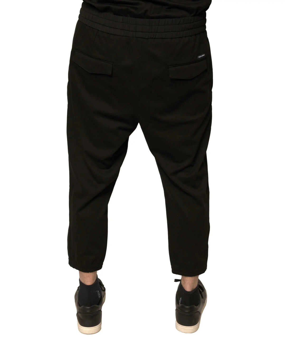 Vue arrière des joggers dolce & gabbana en laine noire avec taille élastique et deux poches arrière en coton noir