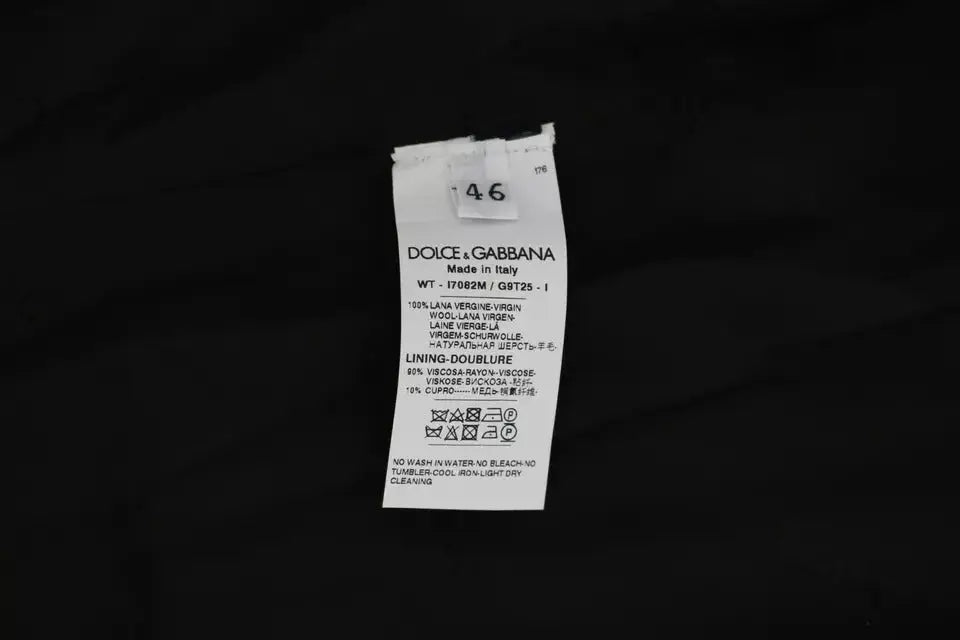 Étiquette blanche dolce & gabbana en tissu avec texte noir indiquant la composition et les instructions de lavage pour veste noire en laine