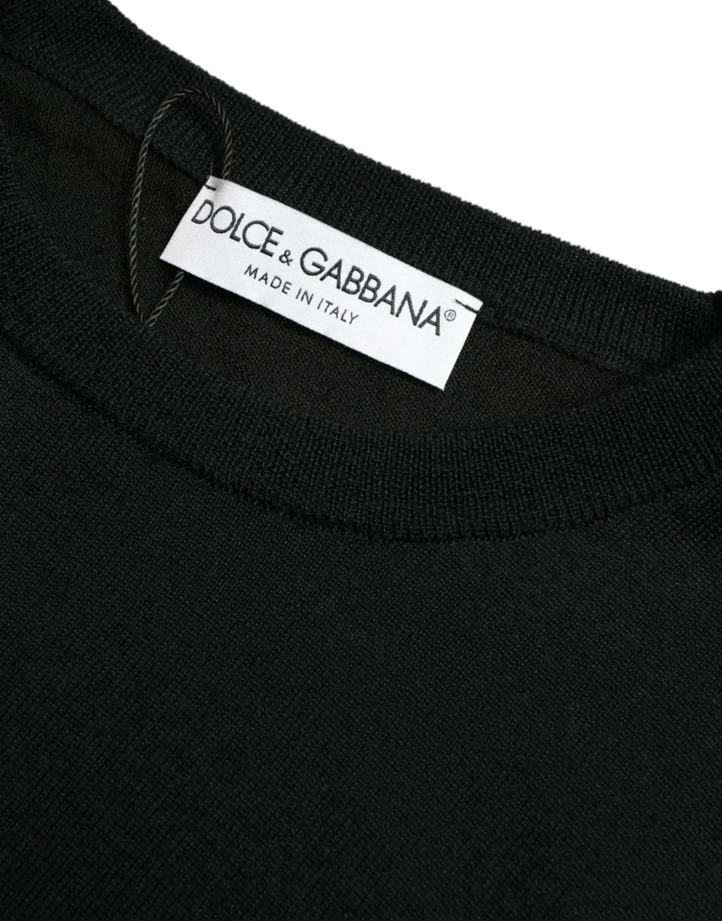 Pull over col rond en laine noire dolce & gabbana avec étiquette blanche made in italy cousue à l’intérieur du col