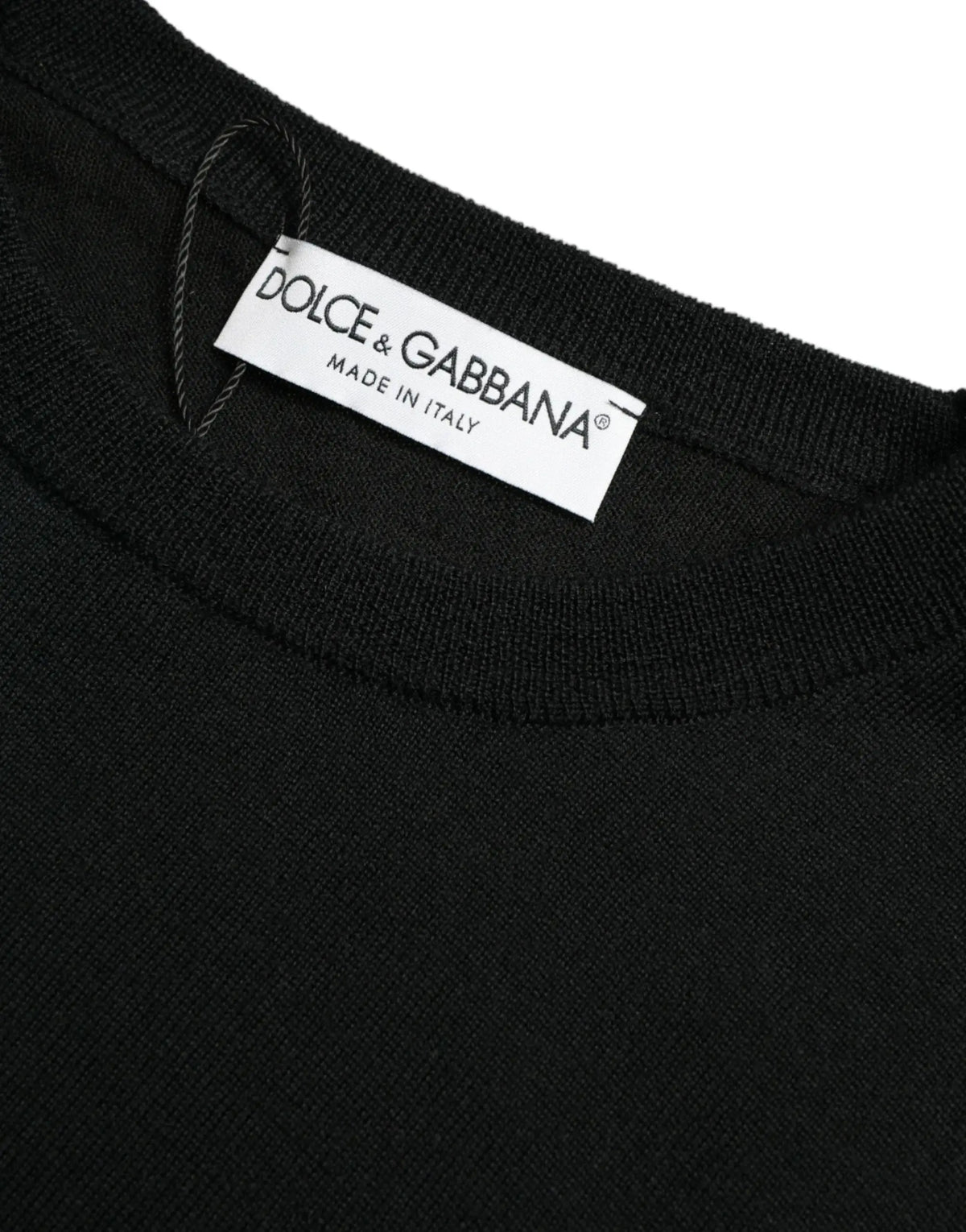 Pull over col rond en laine noire dolce & gabbana avec étiquette blanche made in italy cousue à l’intérieur du col