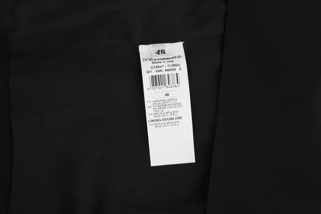Étiquette rectangulaire blanche avec texte noir dolce & gabbana pour gilet noir en laine et soie
