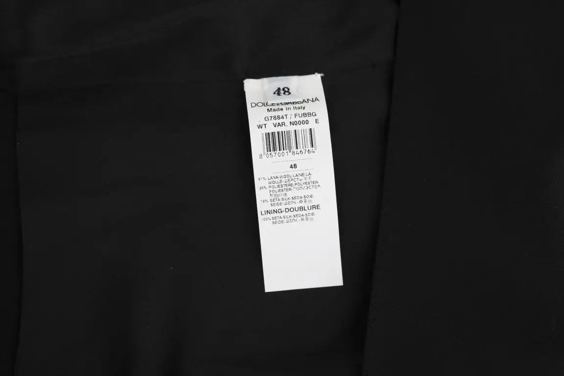 Étiquette rectangulaire blanche avec texte noir dolce & gabbana pour gilet noir en laine et soie