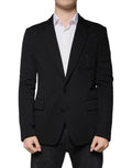 Dolce & Gabbana blazer formel noir en laine avec coupe ajustée et logo brodé subtil sur la poche poitrine