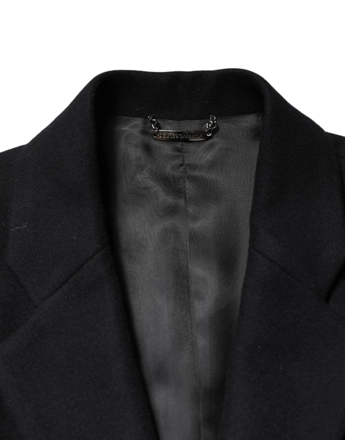 Manteau long en laine noire dolce gabbanas avec doublure satinée et étiquette métallique au col