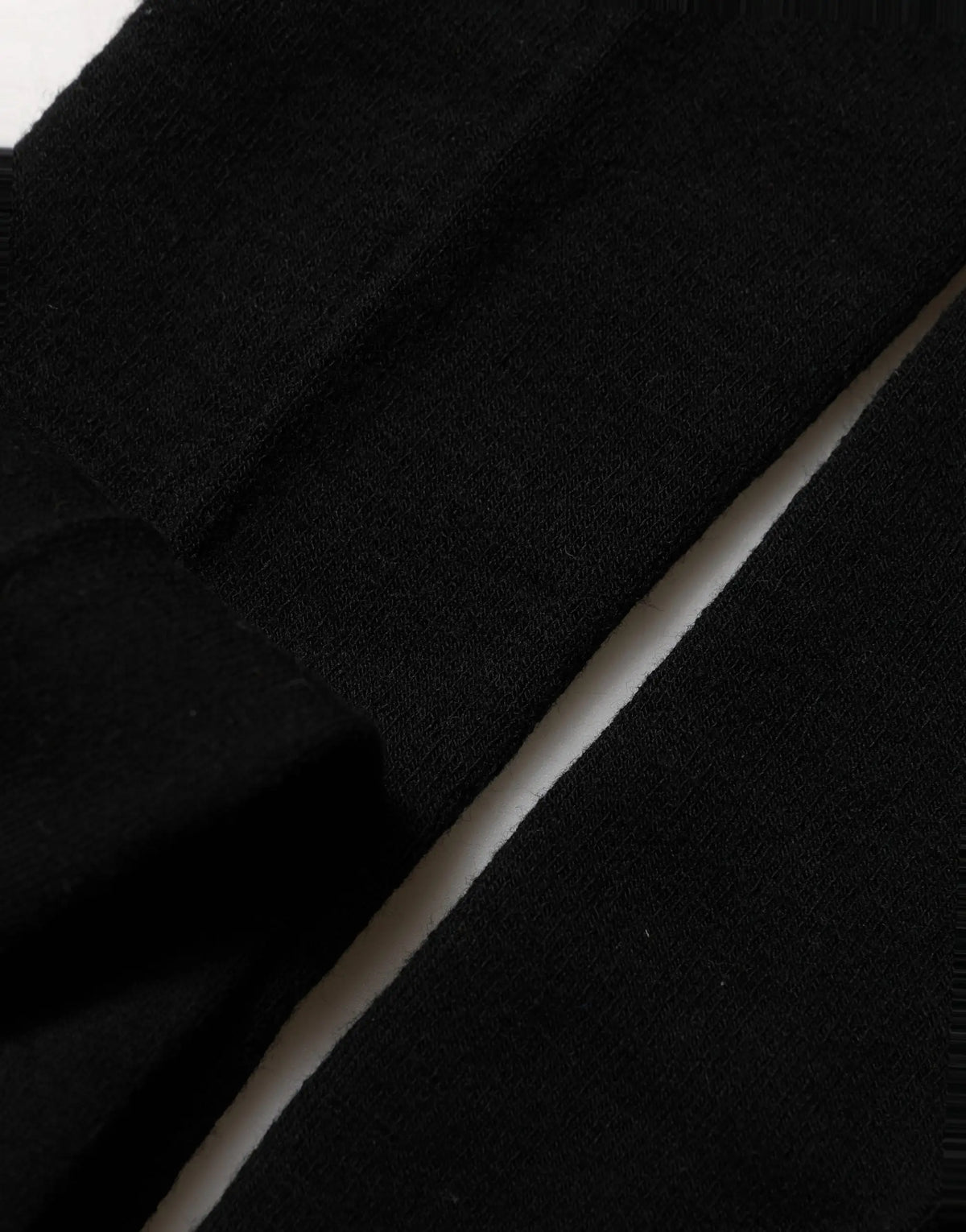 Tissu maille noire avec couture blanche diagonale pour les collants en laine stretch dolce & gabbana