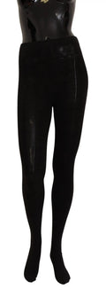Leggings noirs brillants en latex sur mannequin pour les collants en laine stretch dolce & gabbana