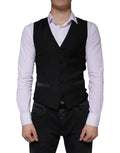 Dolce & Gabbana black wool waistcoat dress with v-neckline, five buttons, and satin trim on front pockets