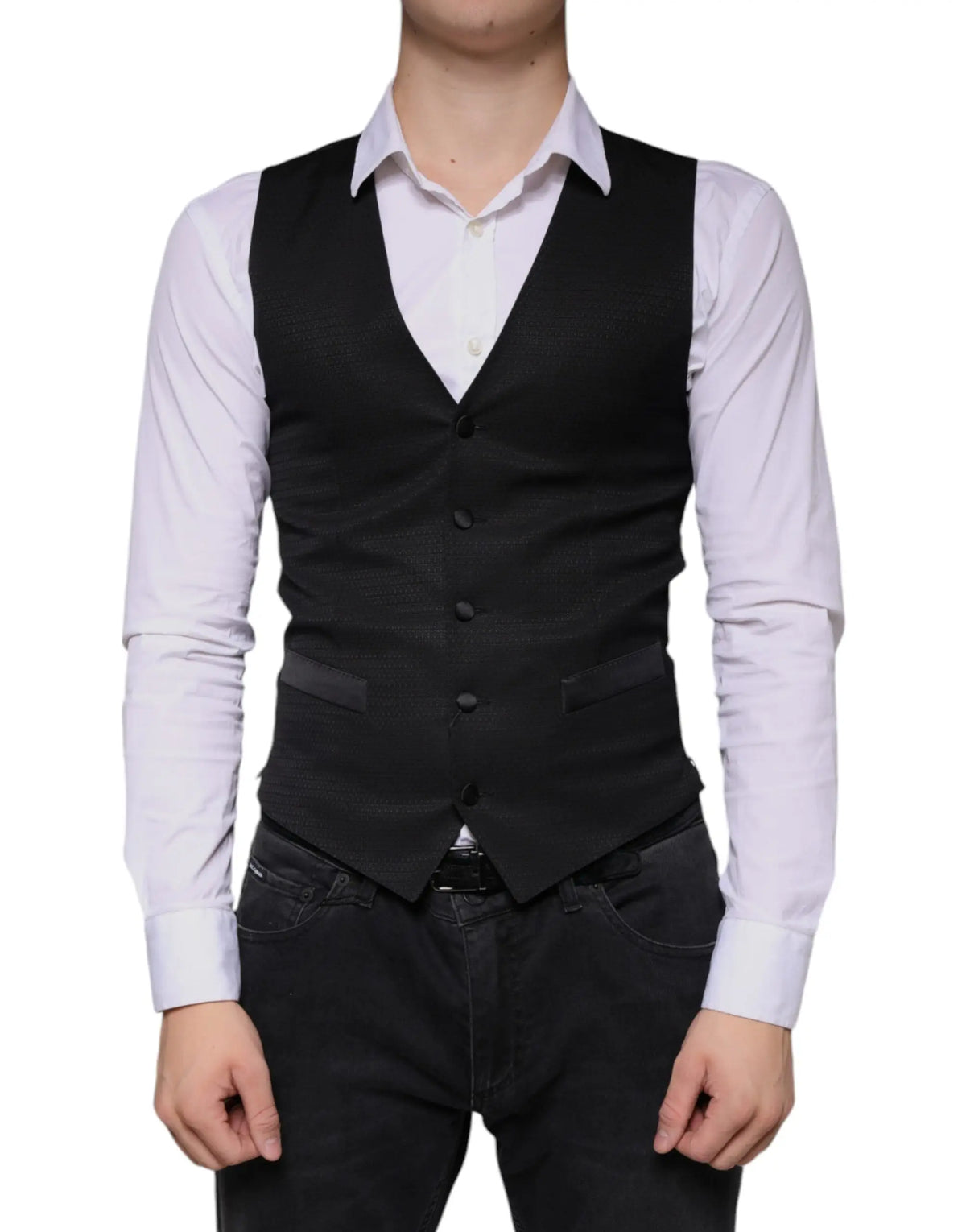 Dolce & Gabbana veste noire en laine avec cinq boutons sombres et texture subtile portée sur chemise blanche