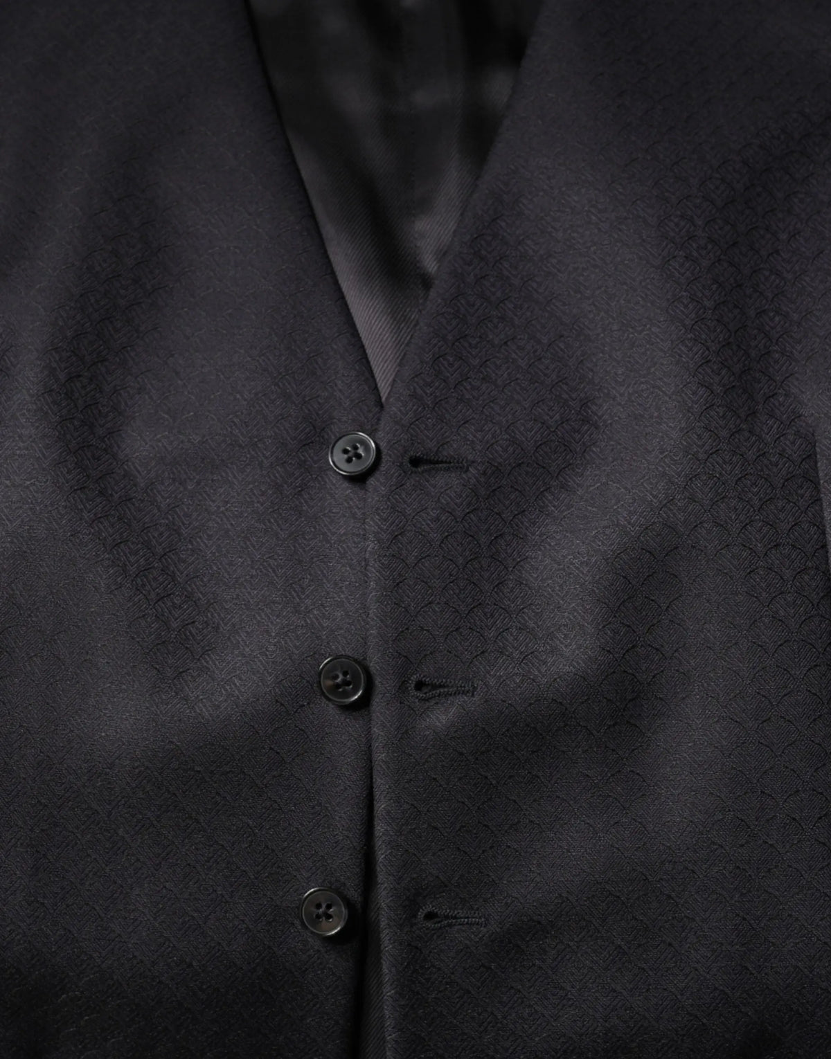Dolce & gabbana black wool waistcoat dress with subtle diamond-patterned weave and matching dark buttons