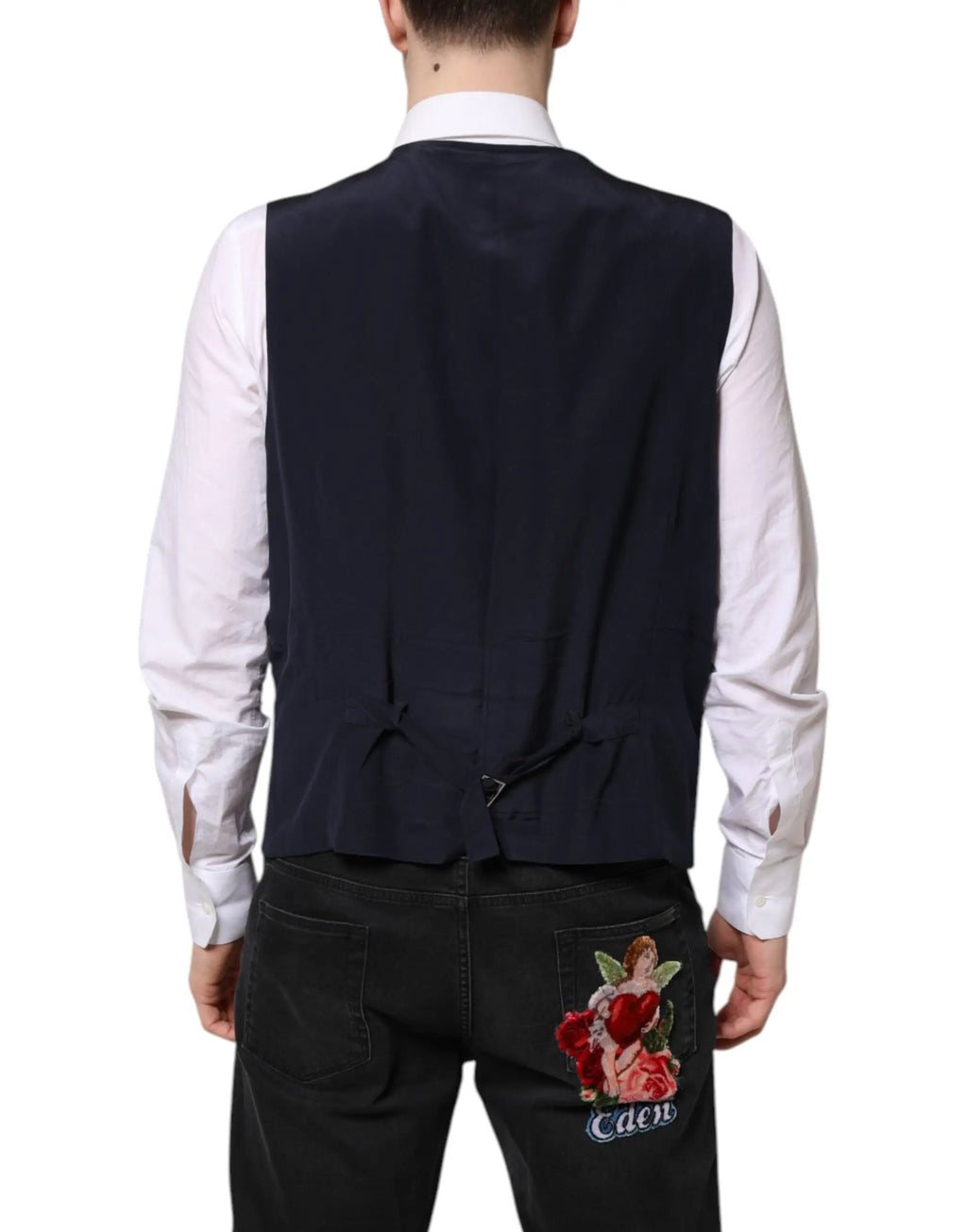 Dos du gilet noir en laine dolce & gabbana avec nœud à l’arrière et broderie ange sur poche arrière