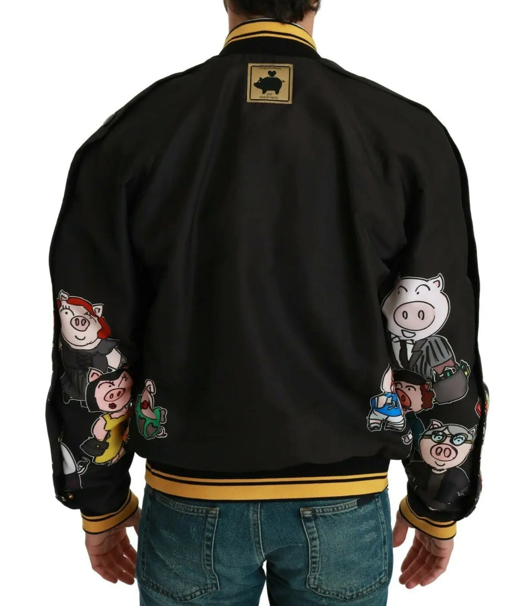 Dolce & gabbana bomber noir avec bordure jaune et patchs cartoon cochon sur les manches
