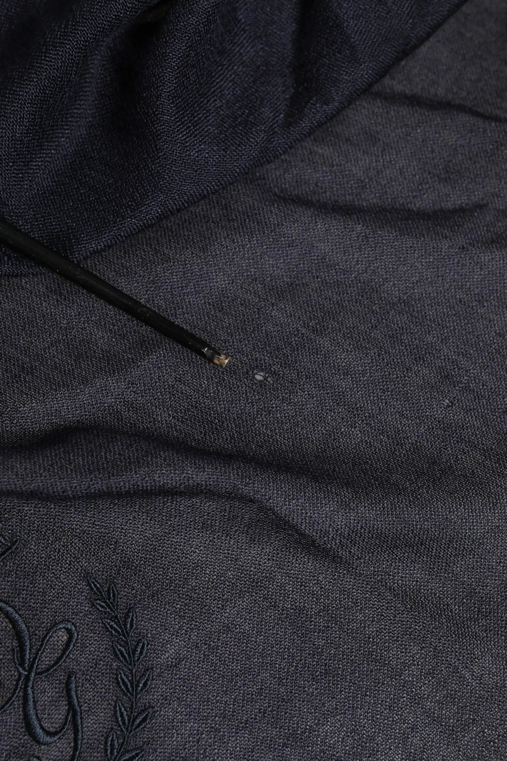 Dark gray knit hoodie with embroidered monogram and laurel wreath detail paired with dolce & gabbana blue cashmere fringes wrap foulard 70cm x 200cm scarf men