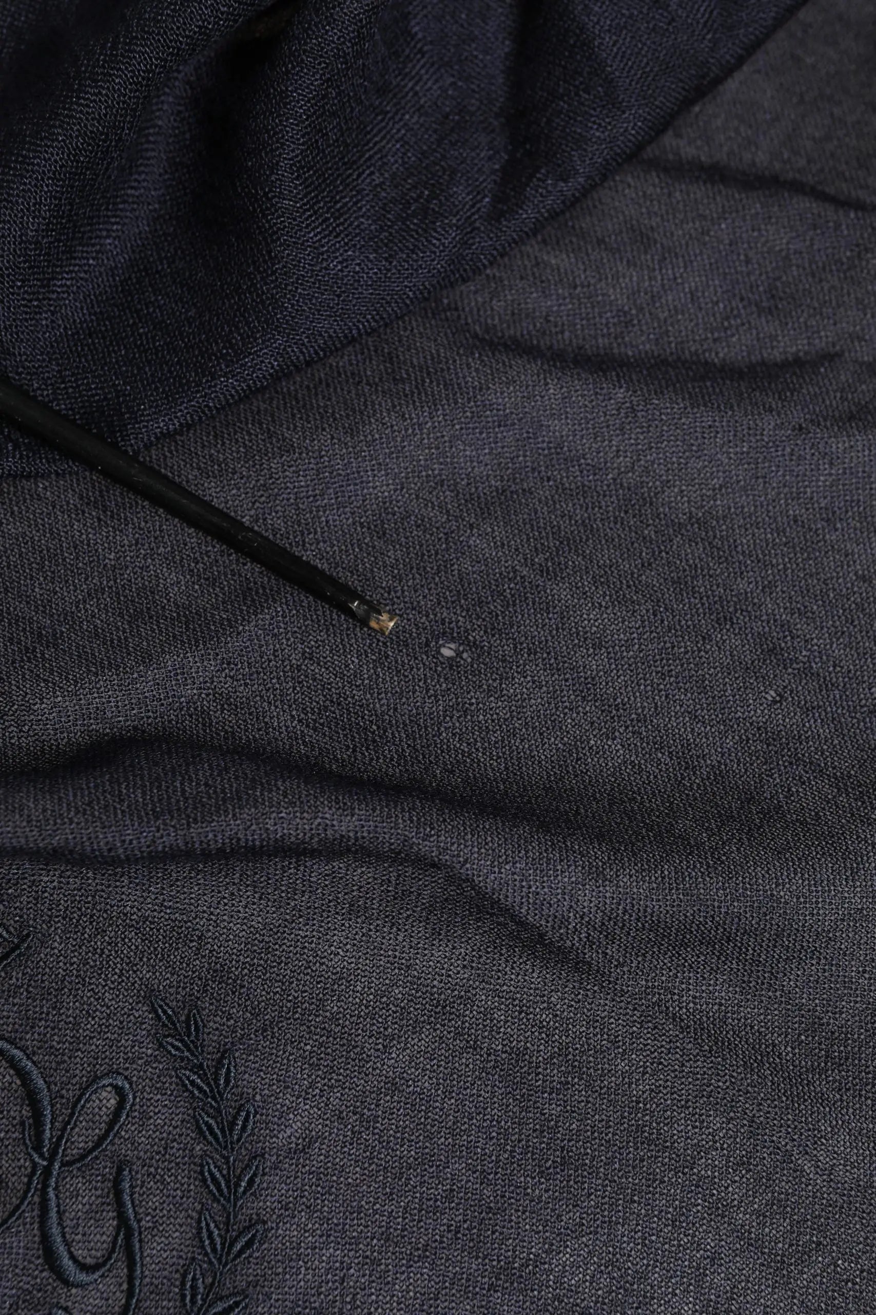 Dark gray knit hoodie with embroidered monogram and laurel wreath detail paired with dolce & gabbana blue cashmere fringes wrap foulard 70cm x 200cm scarf men