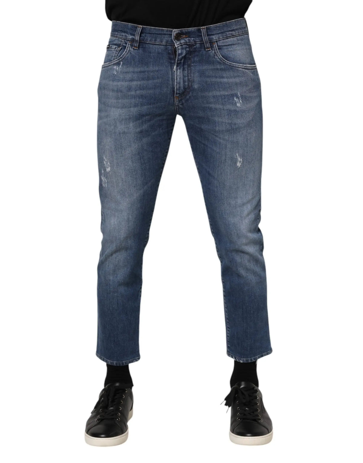 Jean en denim bleu mi-délavé dolce & gabbana en coton avec détails usés subtils et coupe droite