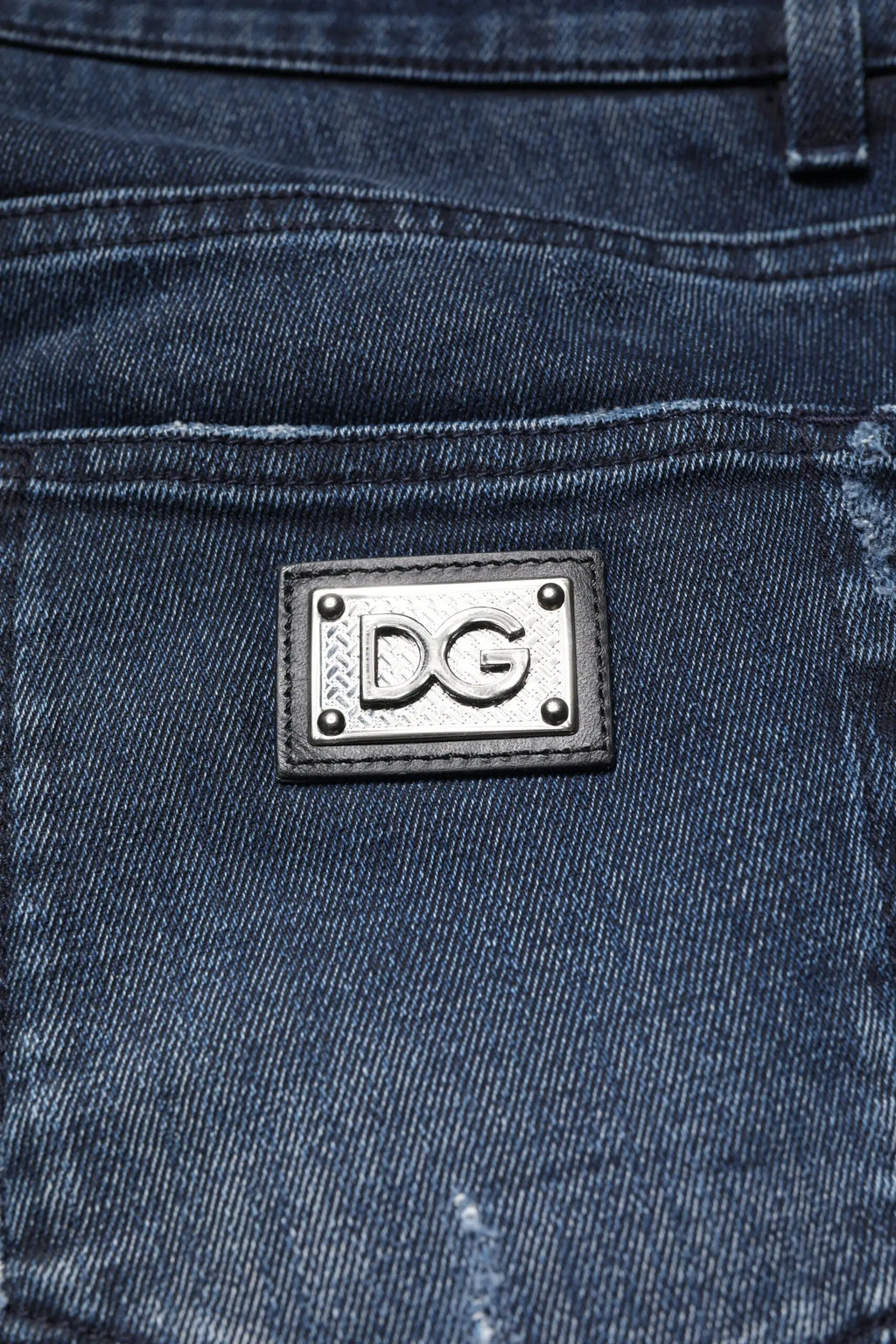 Jean skinny homme en coton stretch bleu dolce & gabbana avec patch logo argent dg et rivets métalliques