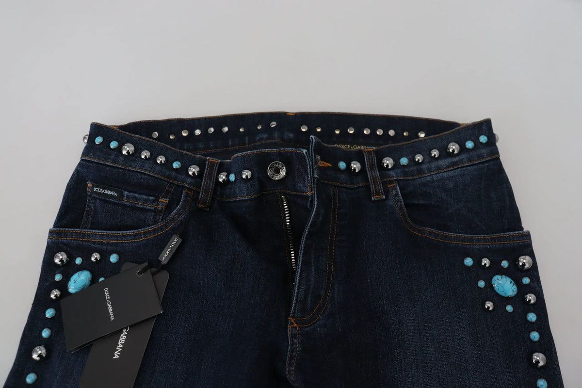 Jean en denim bleu dolce & gabbana à taille basse avec clous turquoise et argent le long de la ceinture et des poches