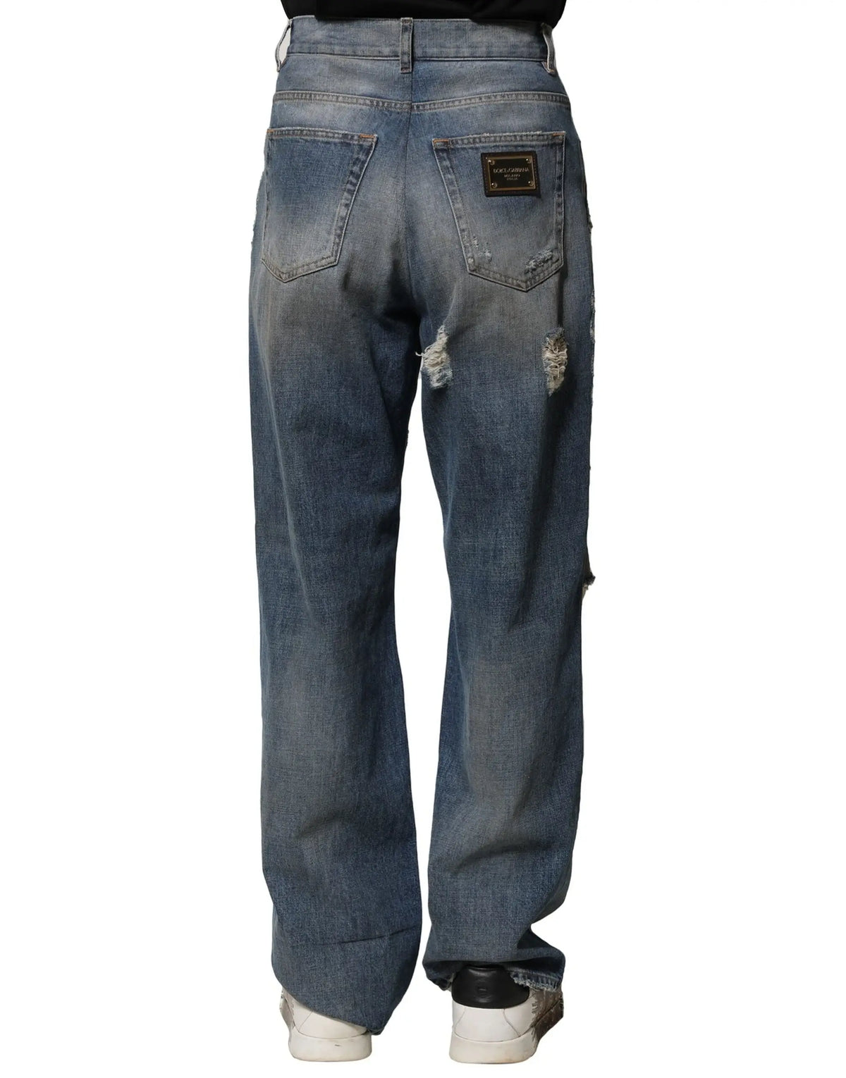 Jean denim délavé bleu distressed dolce & gabbana en coton pour homme avec déchirures et patch doré au dos