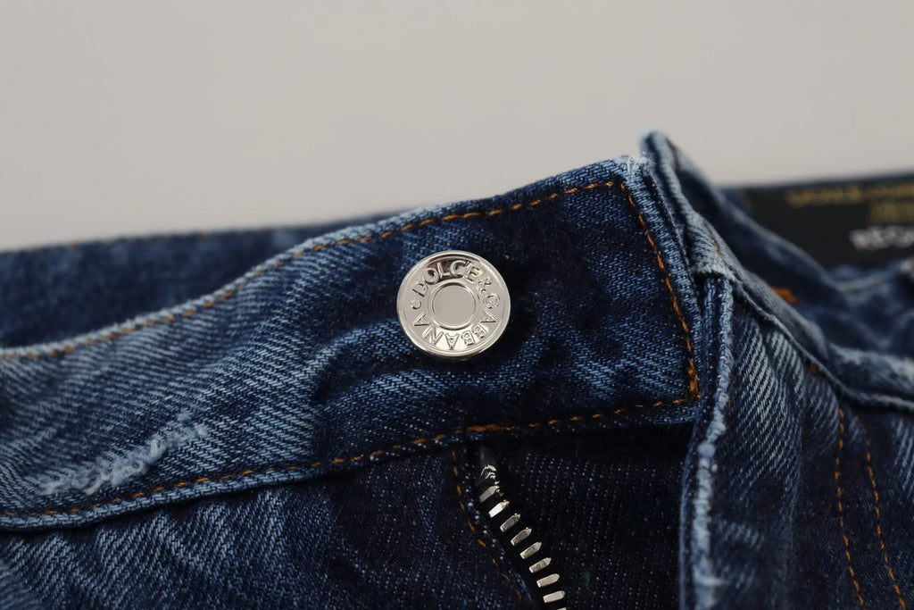Bouton circulaire argent volcanique sur jean bleu en coton déchiré pour homme dolce & gabbana