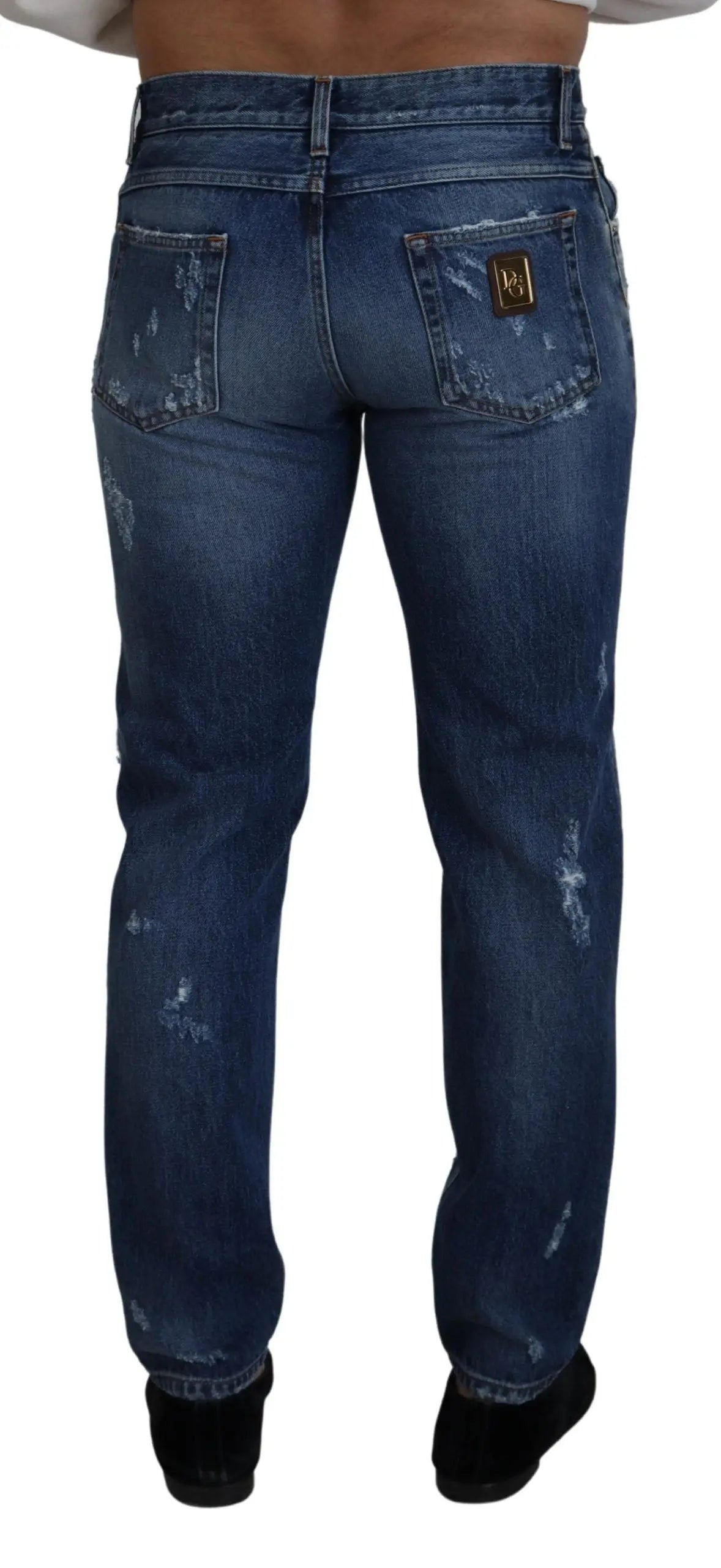 Jeans denim déchirés pour homme en coton bleu foncé avec écusson doré dolce & gabbana au dos droit