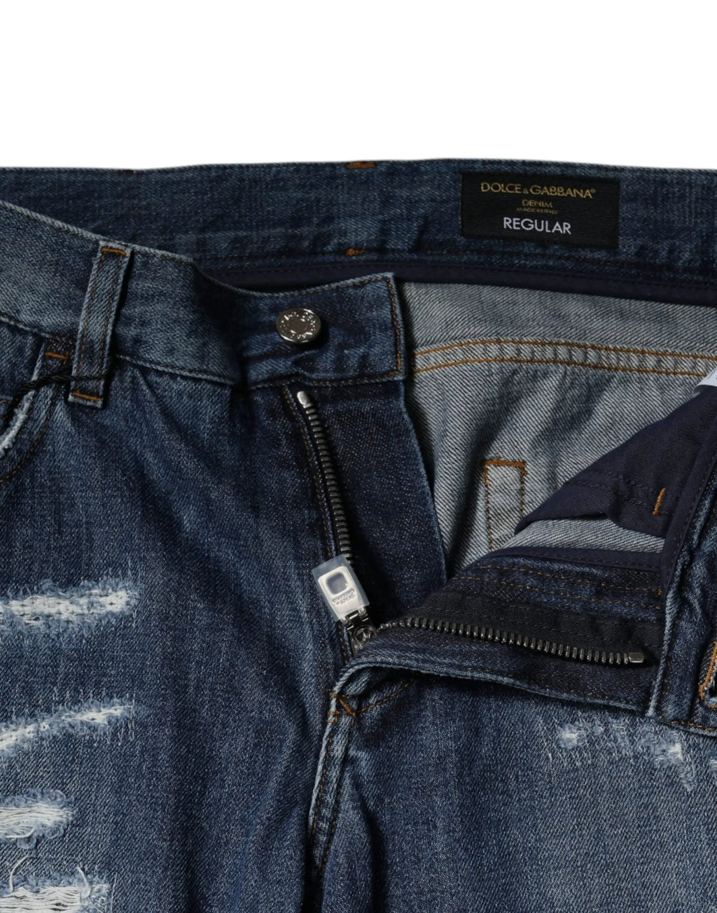 Jeans denim skinny bleu foncé en coton avec effet déchiré et étiquette de marque dolce & gabbana visible