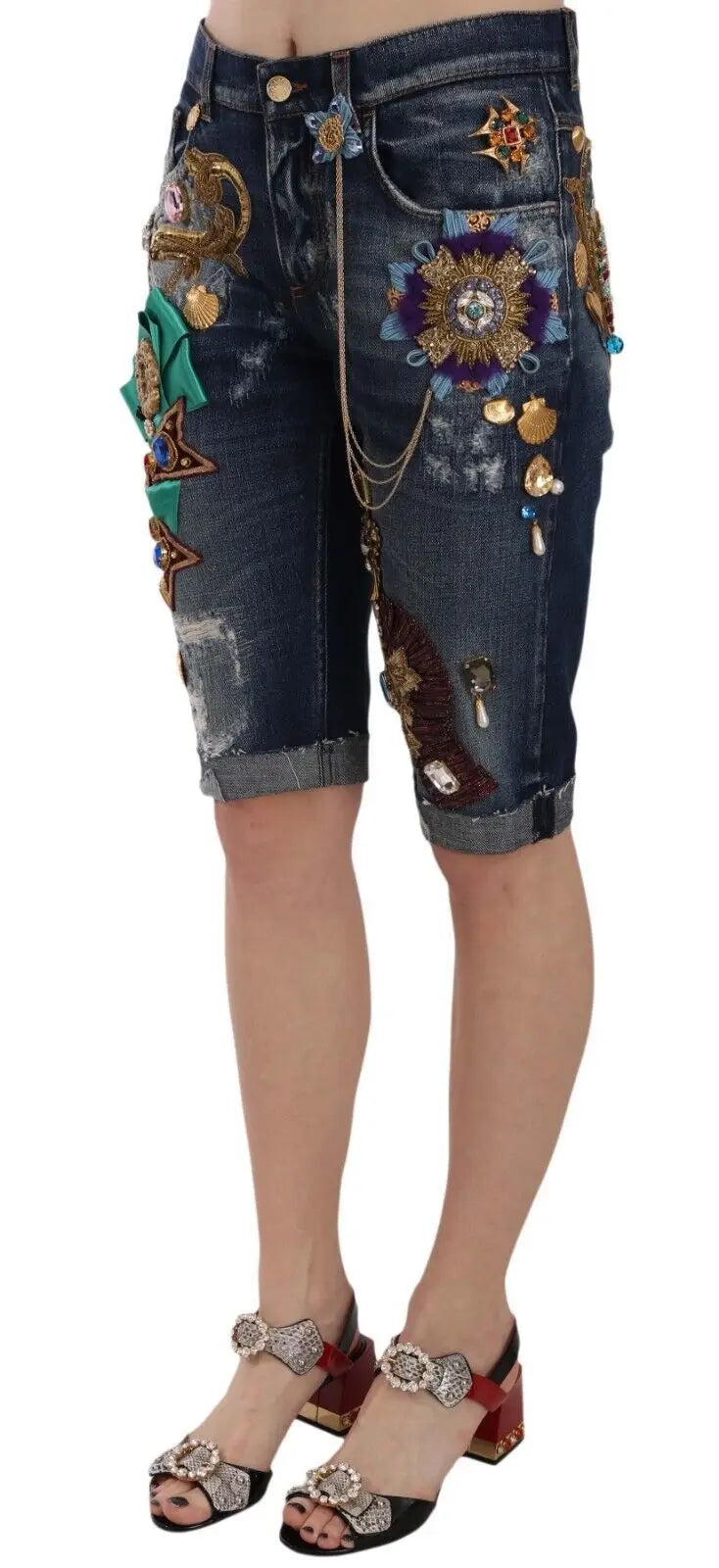 Dark blue denim mid waist capri shorts by Dolce & Gabbana with embroidered floral designs metallic embellishments and chains