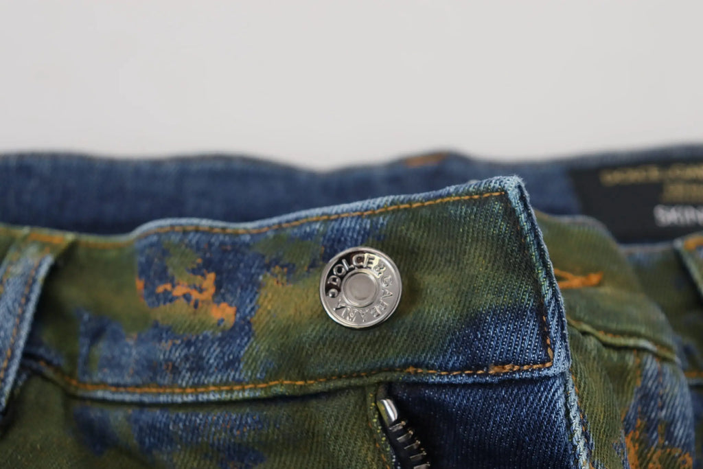 Bouton argenté dolce & gabbana sur jean skinny en coton délavé avec motif camouflage bleu vert orange