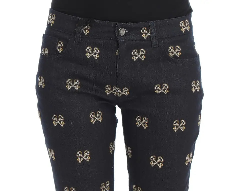 Jean slim fit dolce & gabbana bleu en denim noir avec motif clé brodé or répétitif